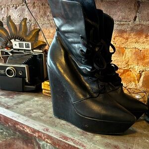 Aldo pointed platform lace-up booties.